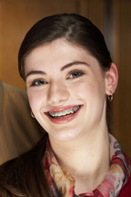 Young girl having braces smiling